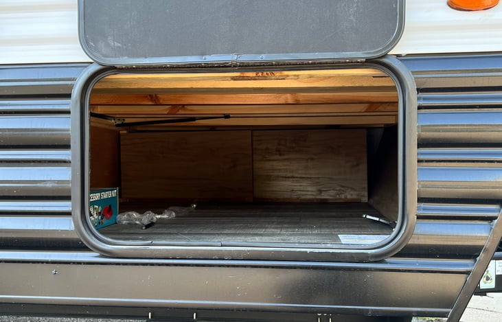 Storage under queen bed accessible from outside