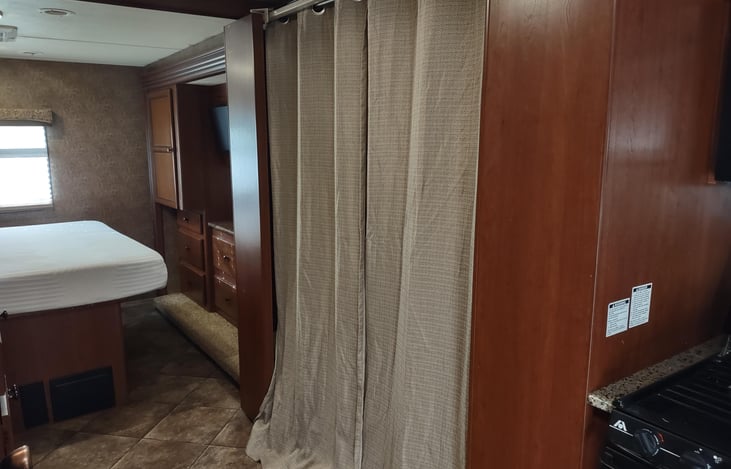 curtains now cover bunk beds for sleeping instead of OEM hard doors