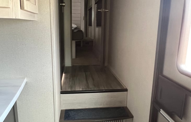 Looking from kitchen/living area into master bedroom.