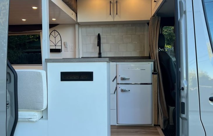 Cook and store your favorites on the go! Our campervan kitchen is equipped with a compact fridge, perfect for keeping your essentials fresh while you explore. Enjoy home-cooked meals and cold drinks.