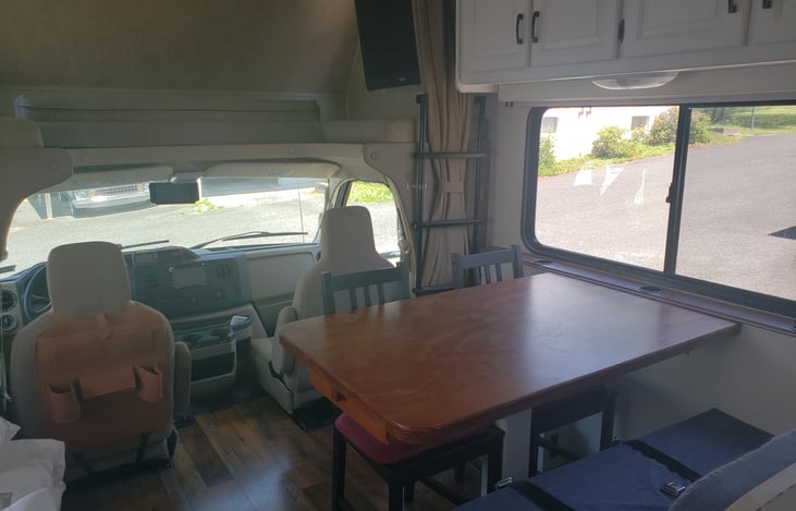 This dinette table is a custom creation that is 50% larger than the original dinette table. It also allows seating for 5-6 rather than just 4.