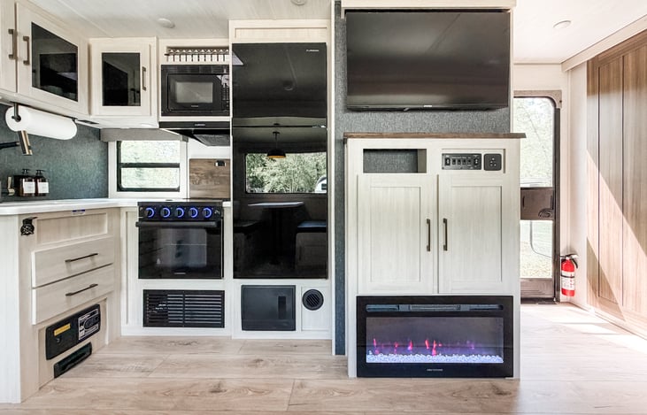 Full kitchen with fridge, freezer, oven, stove, microwave, sink, and cooking essentials.