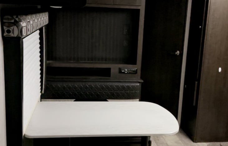 The dinette table makes into a bed as well