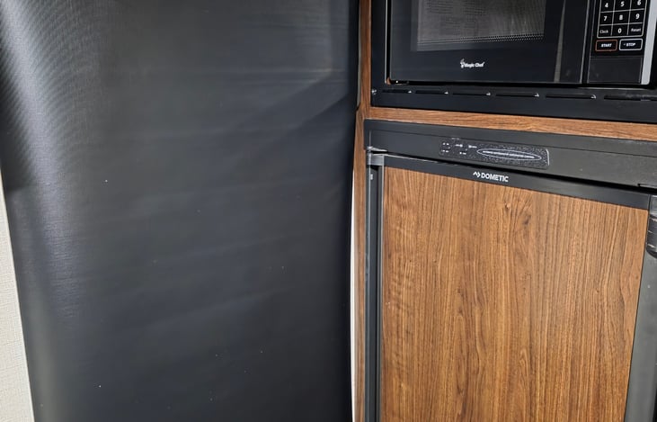 Custom blackout door shade for maximum cooling and privacy.