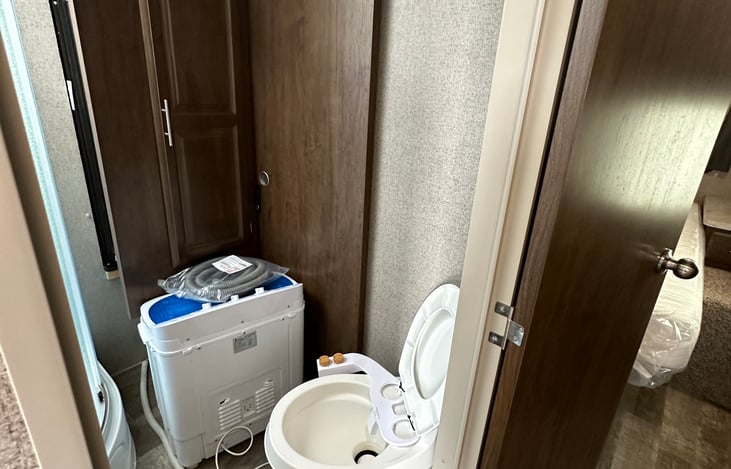 Bathroom area- bidet installed on the toilet