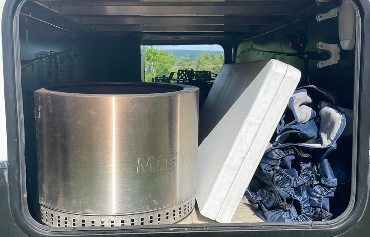 Basement storage - includes smokeless fire pit, outdoor rug, 5 adult camp chairs, 2 kid camp chairs, rubbermaid square table, 2 fishing poles & tackle box , 2 double s'mores sticks, 4 camp pie cookers