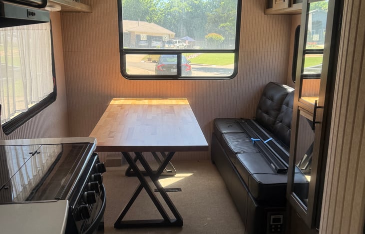 Table can be moved up to the sofa, or sideways at the back window, or over by the bigger window across from the sofa.