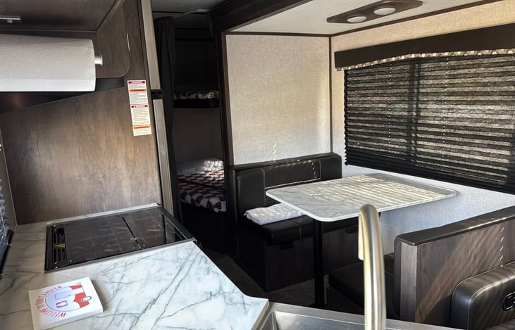 Bunk beds with lighting and USB connections. this photo shows the slideout in. Camper is much more spacious than this photo implies.