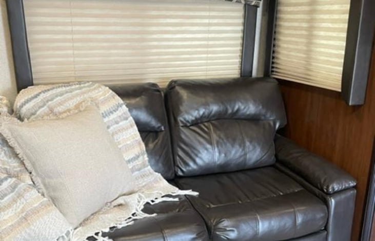 Comfy couch turns into a full size bed with bedding