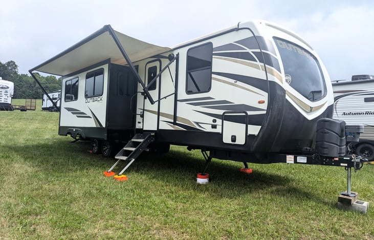 Large outdoor kitchen with sink. Outdoor speakers to keep the tunes going. Large awnings. Plenty of storage throughout. This one has it all.