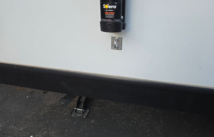 Dog leash hook near the front and back of the awning side of the camper!