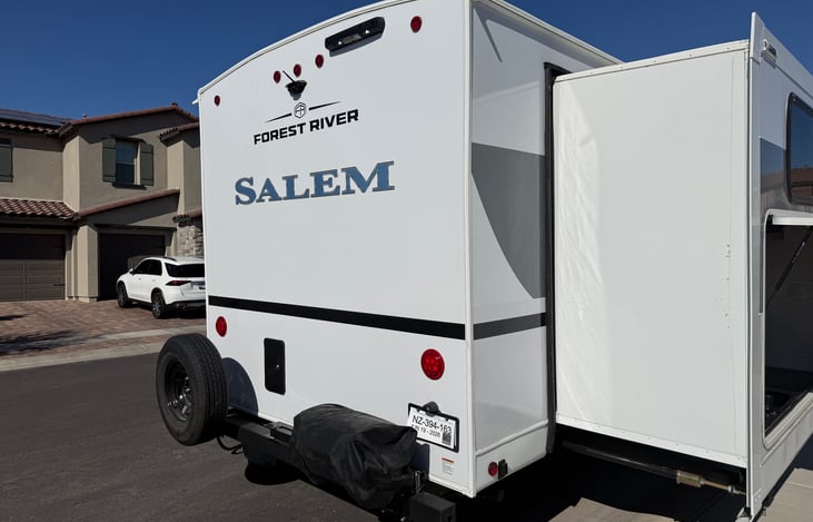 Rear with backup camera, spare tire and Propane grill on swing arm