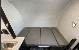 Yes it has a bathroom. Small easy to tow 3200lbs.