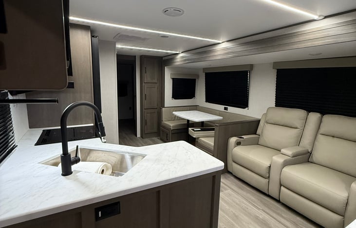 Kitchen/ living room, both chairs recline and table turns into a bed.