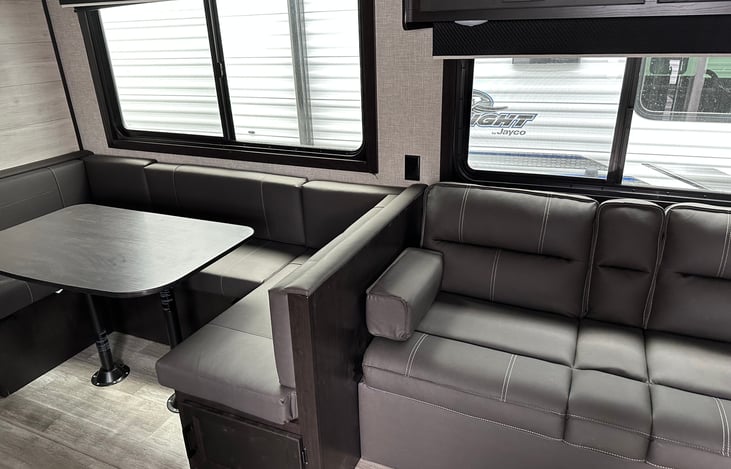 Dinette seats 6 tight, four comfortably and two tv trays stand for couch seating