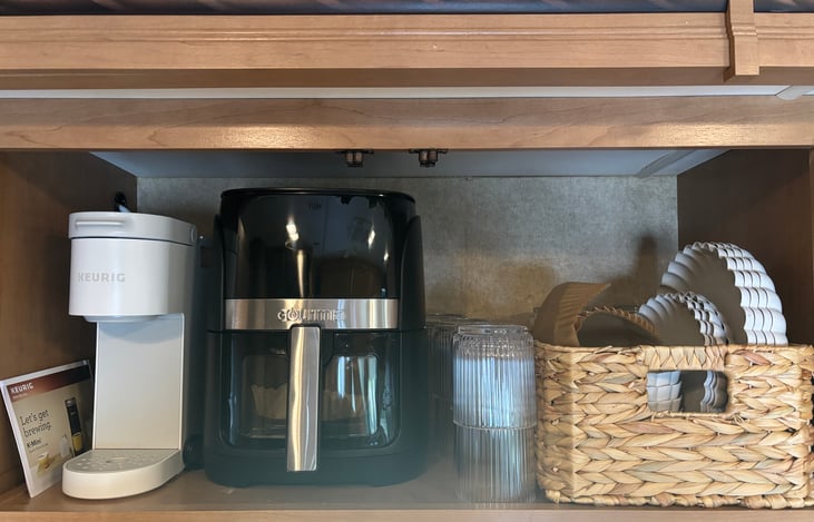 Coffee maker, air fryer, plates and cups all included.