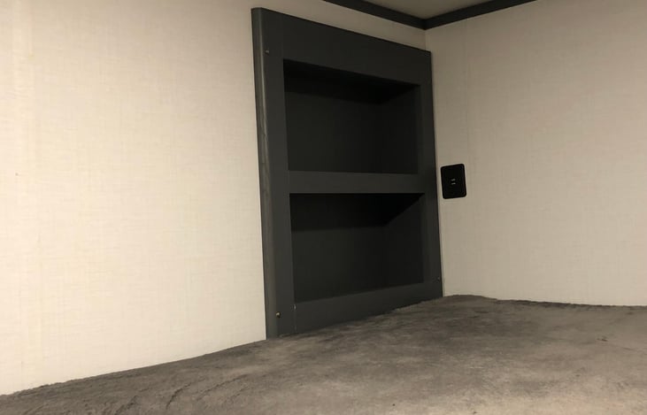 Cubby holes and charging station for the bottom bunk.