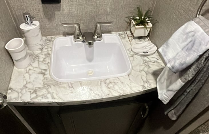 Sink with soap holder, toothbrush holder and soap dispenser, you can put what ever you will like.