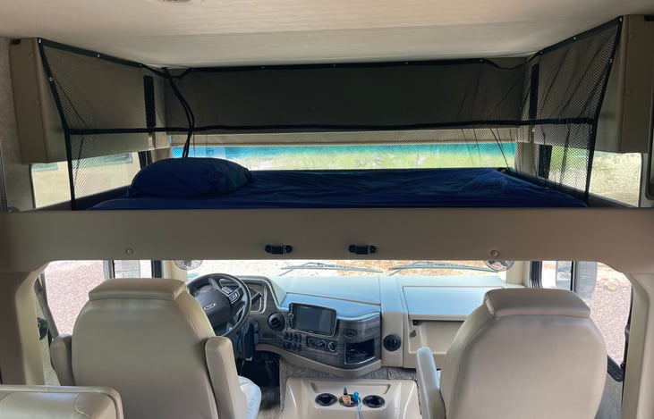 Queen size bed lowers by press of a button for more sleeping or hanging out options.