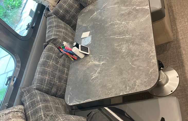 Booth dinette that can be made into a bed. ( Can sleep 1 adult comfortably or two small kids)