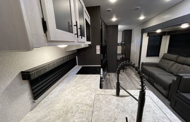 View of spacious living, dining, kitchen, and bunk house area.