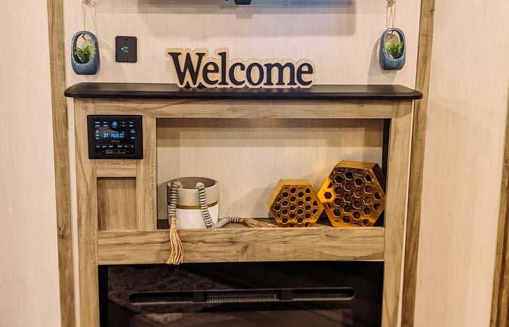 Fireplace, Bluetooth radio, additional USB outlets, and TV. Radio controls outdoor and indoor speakers individually, or have them both on at the same time.