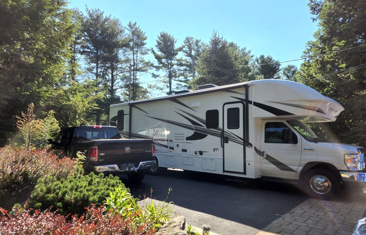 Modern farmhouse interior RV with all the comforts of home. Electric-powered entrance step and grab bar.