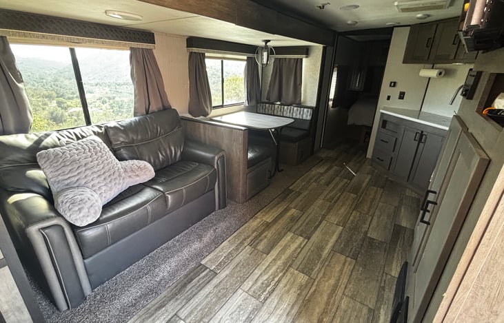 Sofa that converts to queen size bed.  Dining table for 4 converts to Full size bed.