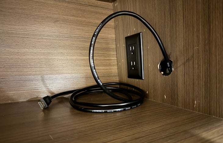 Wiring in cabinet above bed for a video game system or a streaming media player (may need HDMI coupler, not included)