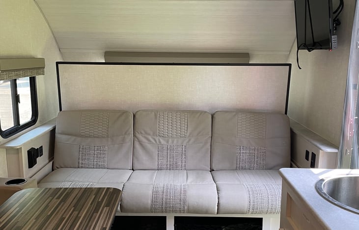 Murphey bed must be in "up position" to retract slide- out during travel.