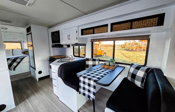 Dinette table will drop down and converts into a bed