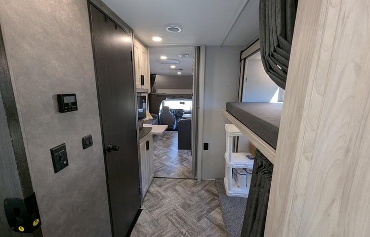 Hallway and "kids-zone" bunkhouse with TV and storage.