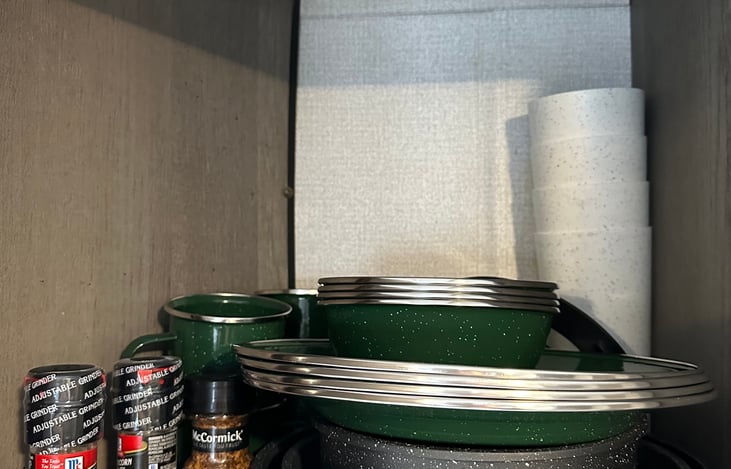 Dishware (plates, bowls, cups, mugs) for 4 people, and basic seasoning