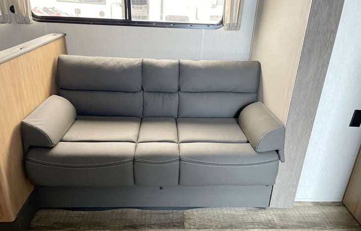 Comfortable luxury-style sofa in open-concept living area