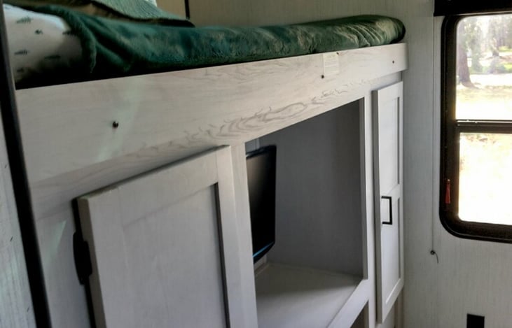 Tv and windows in bunkroom