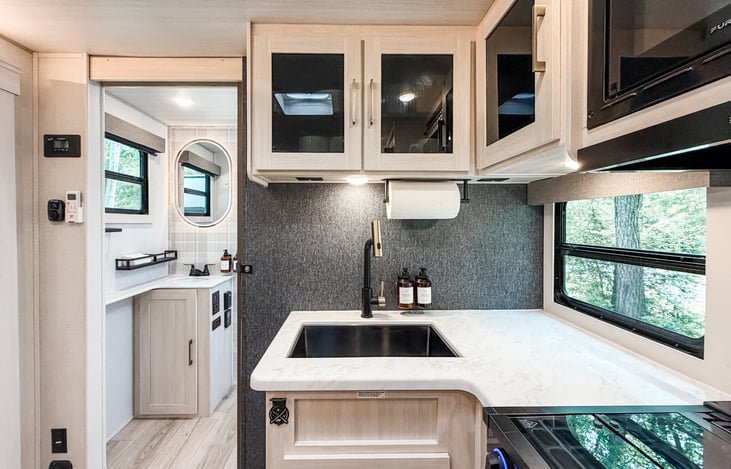 Hand soap, dish soap, paper towels, and stocked kitchen essentials included.