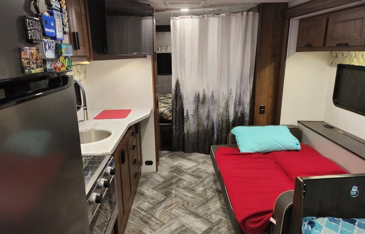 Rear of cabin ready for sleep time! Two privacy curtains for rear bedroom (one makes a path to the bathroom).