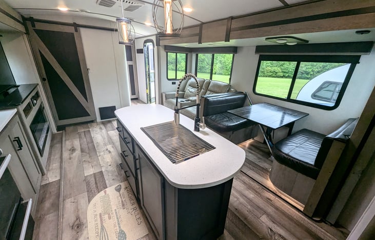 Spacious galley and fully-equipped kitchen. Plenty of room for everyone. Private bunkhouse and private bedroom on opposite ends. Pop-up TV to keep everyone entertained. Ample storage.