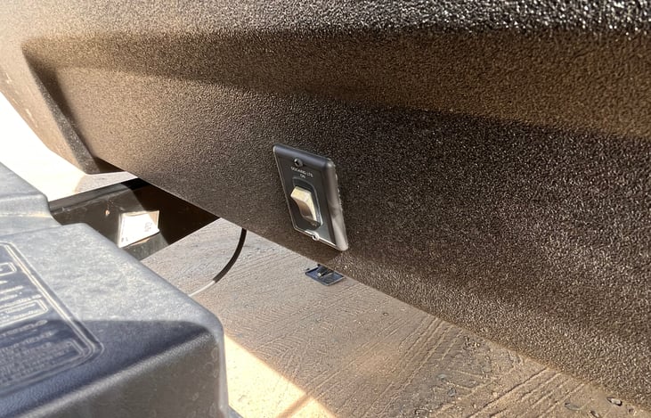 This button controls the light on the front of the camper.