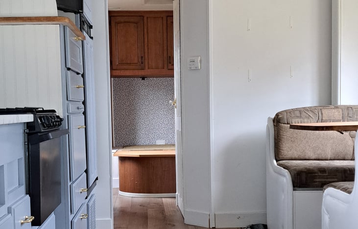 New queen-sized bed not installed on photo.