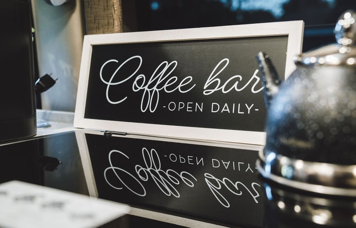 The Coffee Bar comes with a Keurig and completely coffee, cream, and sugar.