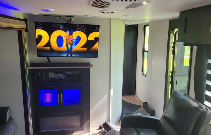 Giant 50" LCD TV has Blu-ray and digital antenna connected and extra HDMI cable included. 5.1 Surround sound bar is bluetooth capable and has excellent sound.