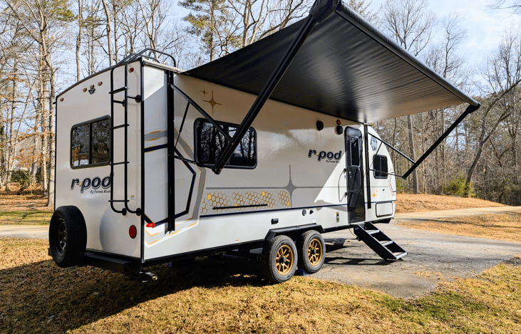 Experience luxury in this 2024 R-Pod 204! Loaded with modern amenities and technology, this whimsical camper features a walk-through bath, a queen-bed slide, on-demand water heater, solar power, inver