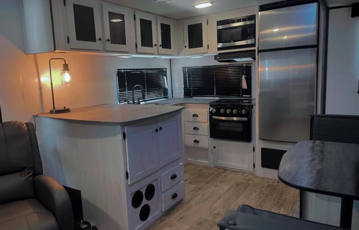 View of kitchen with built-in appliances.
