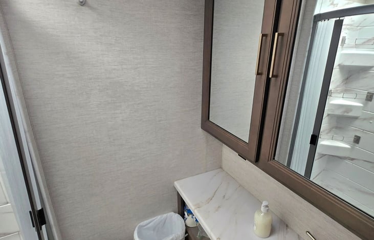 Large bathroom with great mirror and storage