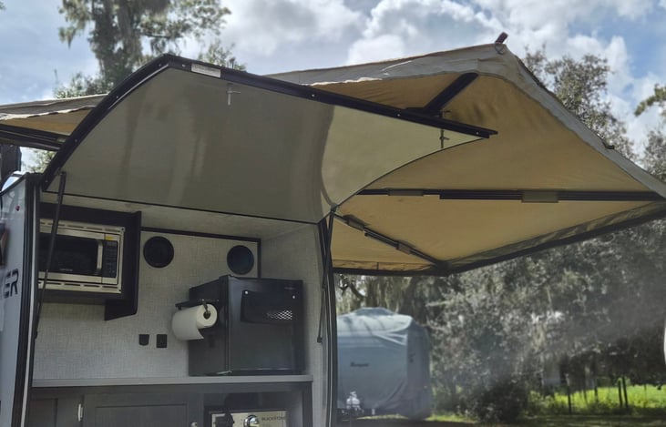 Outdoor kitchen and included 270 awning