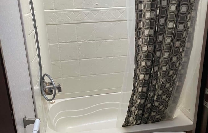 Bath includes tub and shower.
