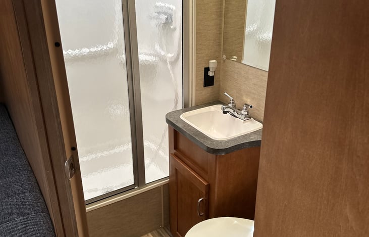 Shower ,sink( second sink) and toilet in one stall