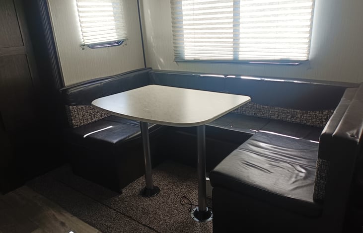 Booth Style Dining Tablethat sits up to 6 comfortably... Converts to bed that sleeps 2 adults