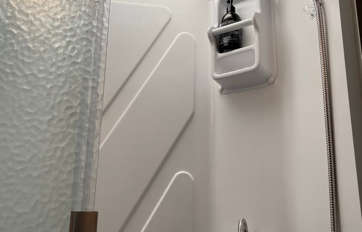 Shower stall. Surprisingly spacious. Don't hog the hot water.